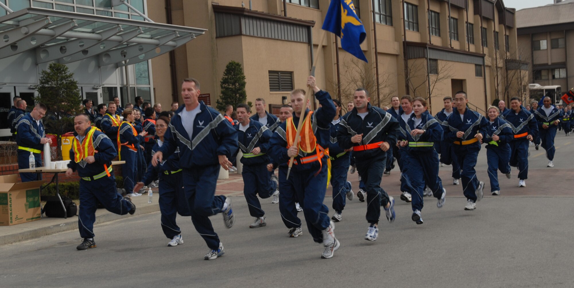OSAN AIR BASE, Republic of Korea --  Members of the Seventh Air Force finish up the Commander's Warrior Run on Thursday. The 2-mile, team-building run began and ended in front of the Osan Fitness Center here. (U.S. Air Force photo by Airman 1st Class Chad Strohmeyer)