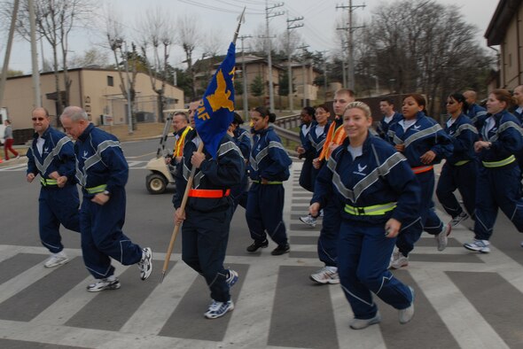 OSAN AIR BASE, Republic of Korea --  Lt. Gen. Stephen Wood, Seventh Air Force commander, leads Airmen during the Commander's Warrior Run Thursday. The 2-mile, team-building run began and ended in front of the Osan Fitness Center here. (U.S. Air Force photo by Airman 1st Class Chad Strohmeyer)