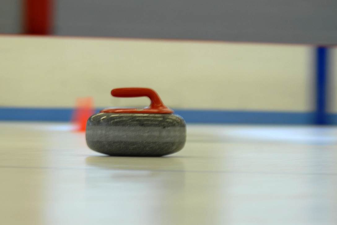 A set curling stone slides across the ice during the curing event at the Lewis Ice Arena in Aspen, Co., during the National Disabled Veterans Winter Sports Clinic April 4, 2007.