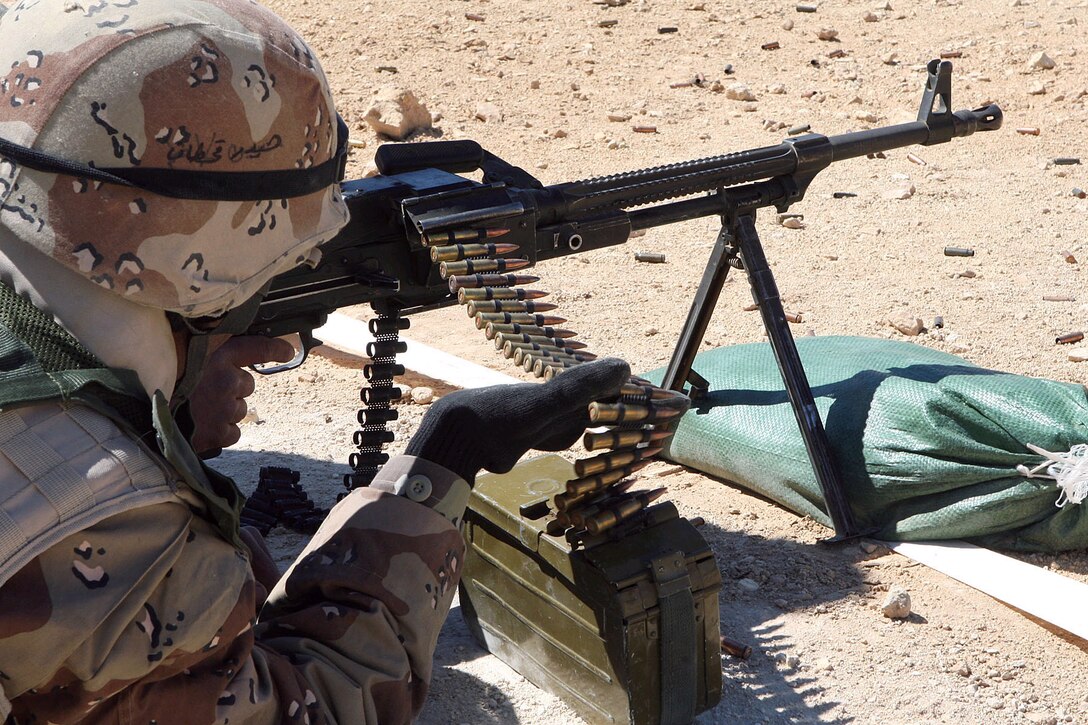 Iraqi Army soldiers spend a day at the range, firing the PKC machine gun as part of the School of Infantry, April 4, 2007.
