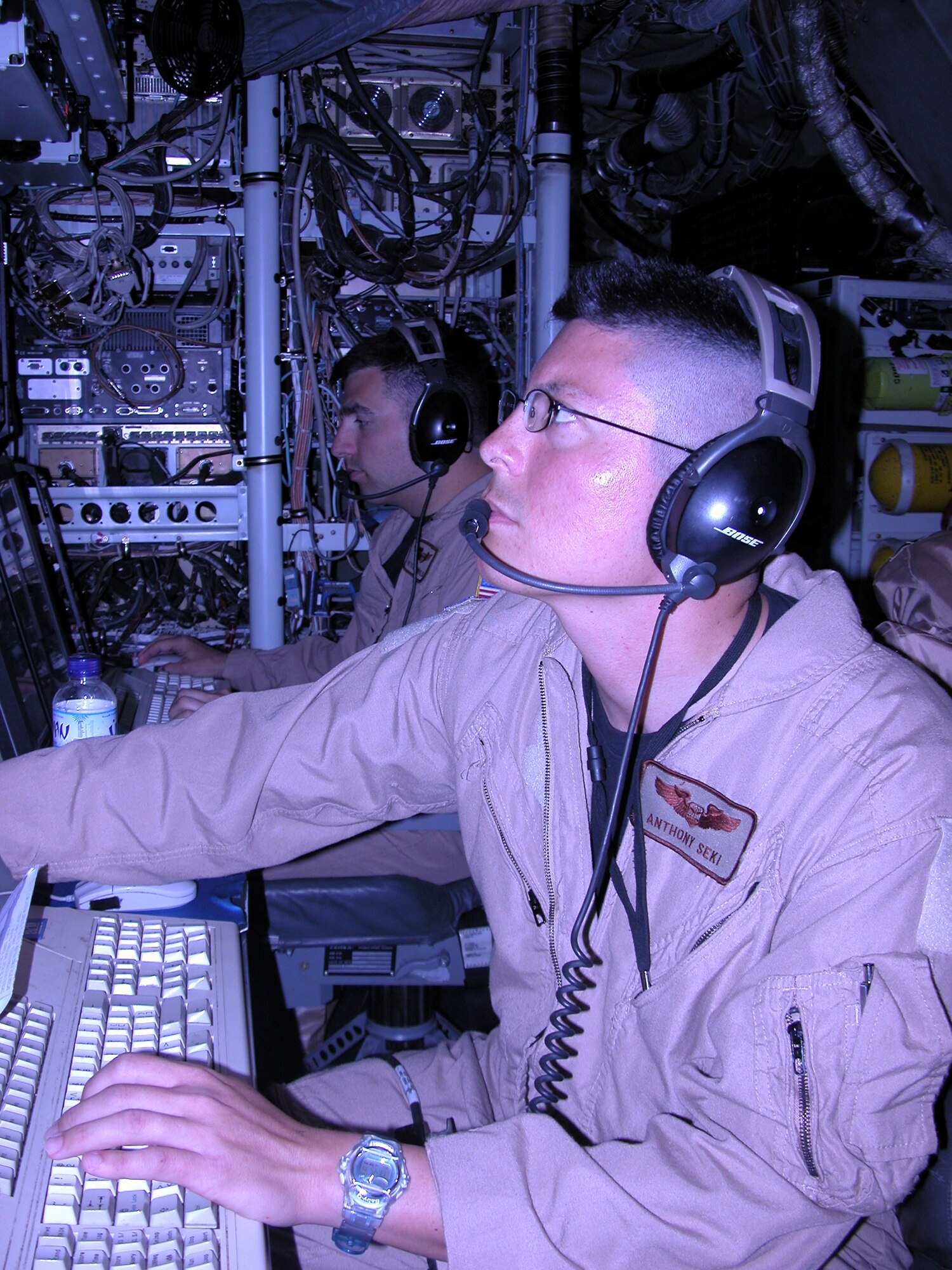 Capt. Anthony Seki, 763rd Expeditionary Reconnaissance Squadron electronic warfare officer, keeps a watchful eye during a mission Wednesday on a RC-135 Rivet Joint. The 763rd ERS mission is to provide real time on-scene intelligence collection, surveillance and analysis to forces in the air and on the ground. (U.S. Air Force photo)