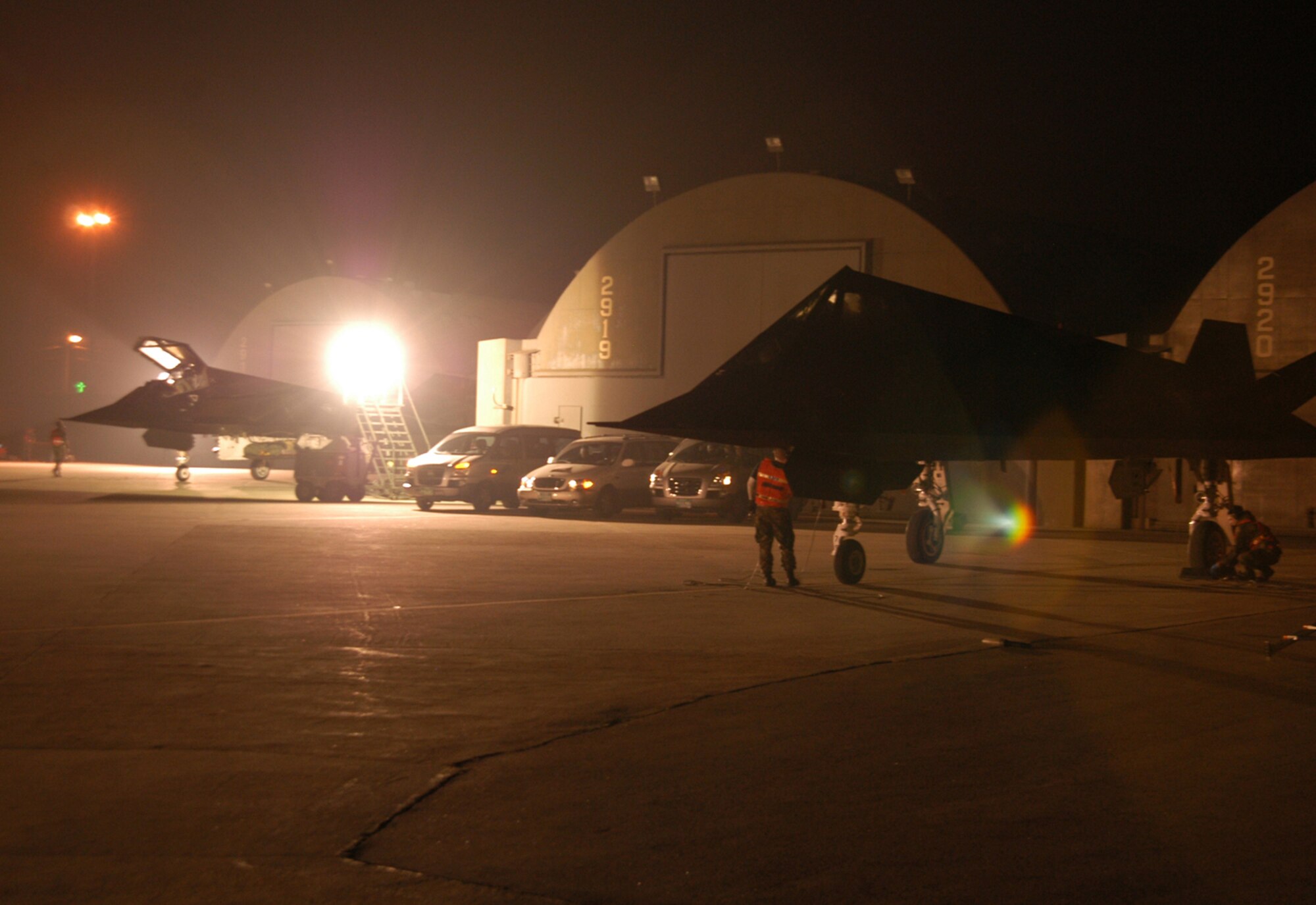 KUNSAN AIR BASE, Republic of Korea  April 9, 2007 -- Two F-117 Nighthawk stealth fighters are prepped for flight by their crew chiefs April 9 here. The fighters, which began redeploying last week, are the last of the F-117s leaving for Holloman Air Force Base, N.M. The low-observable aircraft, assigned to the 9th Expeditionary Fighter Squadron, have been deployed to Kunsan since early January. Maintainers and support personnel are expected to redeploy in the coming week. (U.S. Air Force photo/Senior Airman Stephen Collier)