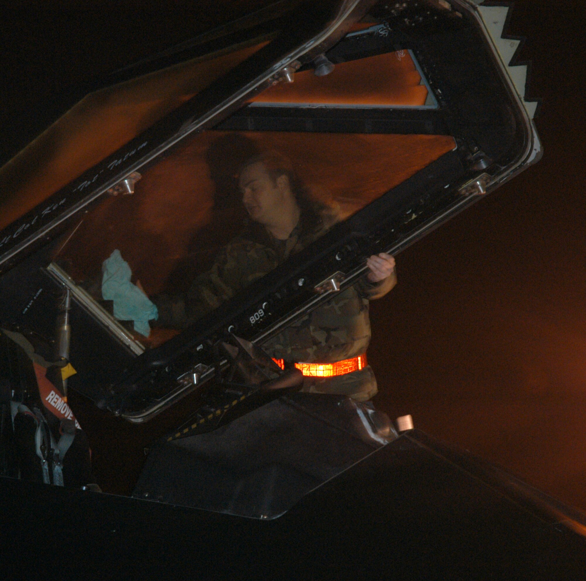 KUNSAN AIR BASE, Republic of Korea  April 9, 2007 -- Staff Sgt. Chad Daugherty, 9th Expeditionary Fighter Squadron dedicated F-117 crew chief, wipes moisture from the cockpit of an F-117 Nighthawk stealth fighter April 9 here. The aircraft is one of the last of the F-117s to redeploy to Holloman Air Force Base, N.M. The low-observable aircraft, assigned to the 9th Expeditionary Fighter Squadron, have been deployed to Kunsan since early January. Maintainers and support personnel are expected to redeploy in the coming week. (U.S. Air Force photo/Senior Airman Stephen Collier)