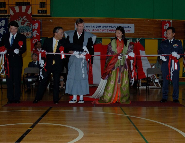 Misawa Air Base, Japan -- Col. Terrence O'Shaughnessy (center), 35th Fighter Wing commander, along with members of Misawa Air Base and the surrounding area cut the ribbon during the opening ceremony of the 20th Annual Japan Day Celebration at Misawa Air Base, Japan on April 7, 2007.  Japan Day is held annually to support Japanese/American relations.  During the day, Americans are given a chance to see traditional Japanese customs without having to leave the base.  U.S. Air Force photo by Senior Airman Laura McFarlane