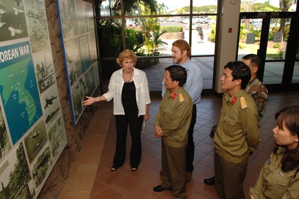 HICKAM AIR FORCE BASE, Hawaii -- Ms. Christi Shaw, PACAF Historian, conducted a tour for the Vietnamese delegation, Brig. Gen. DO Hoa Binh, Col TRAN Duc Thanh, Senior Capt NGUYEN Thi Mai Anh, and linguists Ron Ward and MSgt S Nguyen from JPJAC.  This visit is part of the nursing exchange program which started at the 15th Annual Asia-Pacific Military Medical Conference where the Vietnamese requested that the two countries develop a cooperative relationship between the U. S. and Vietnamese Military Nursing communities. (Air Force photo by Mark Bates)
