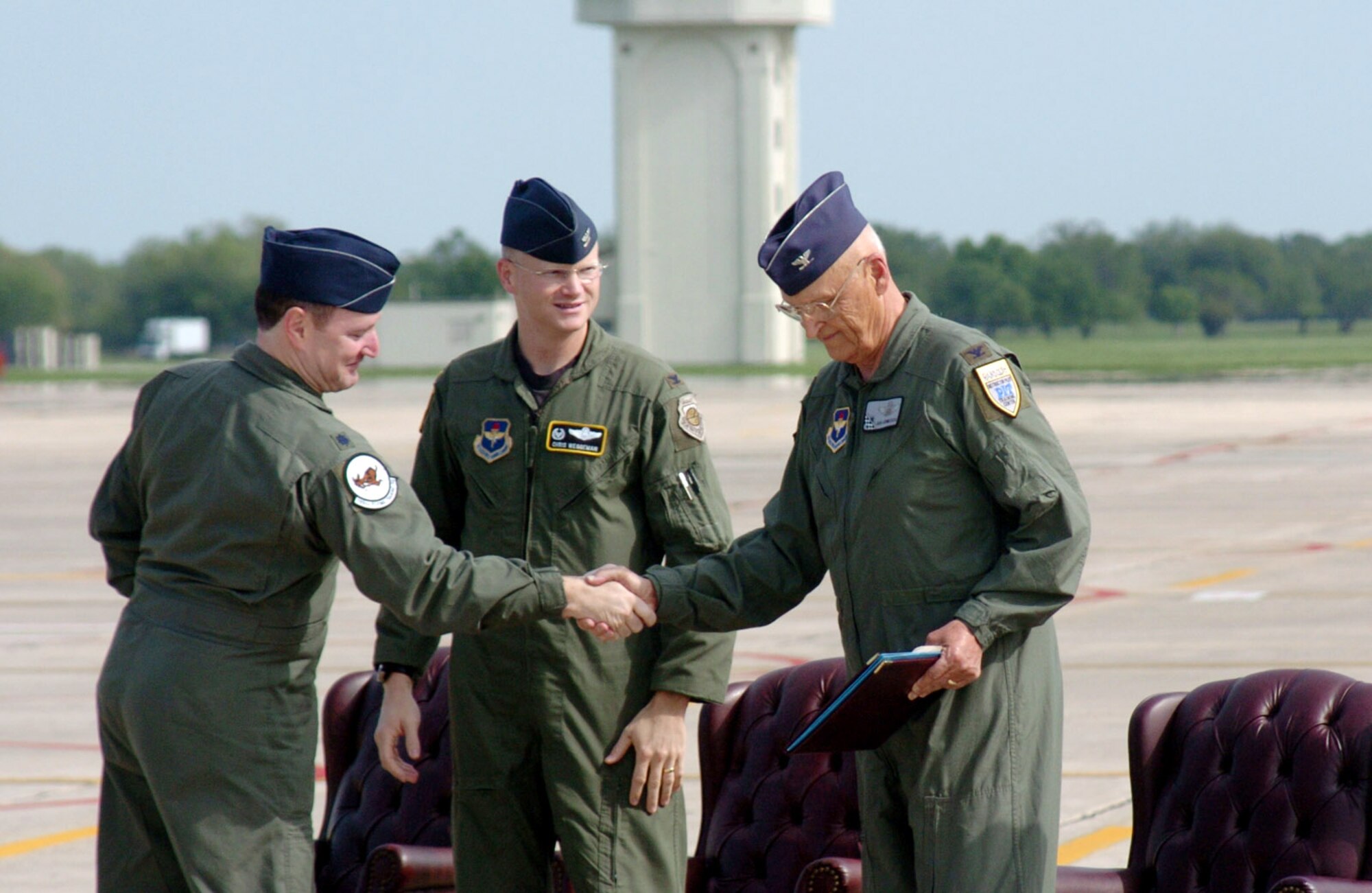 Lt. Col. Jimmy Donohue, (left) 559th Flying Training Squadron commander, and Col. Christopher Weggeman, 12th Operations Group commander, thank retired Col. Robert Hermanson, 559th FTS commander from July 1974 to July 1976, for his service with the unit and the Tweet. Colonel Hermanson was the guest speaker at the T-37B base retirement ceremony April 6. (U.S. Air Force photo/Dave Terry)