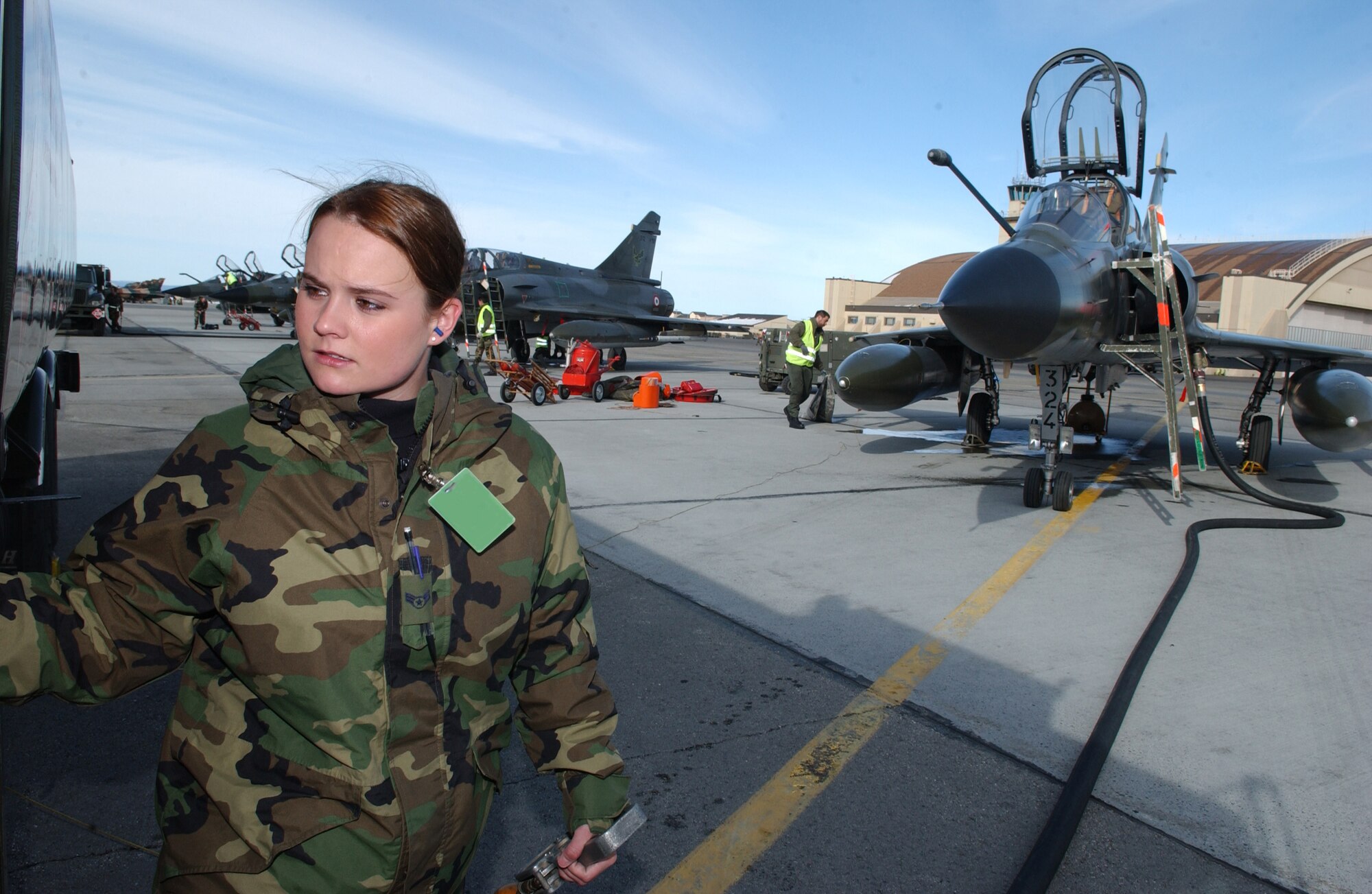 EIELSON AIR FORCE BASE, Alaska -- Airman 1st Class Ashley Pranther, 374th Logistics Readiness Squadron, Yokota AB, refuels a Mirage 2000 with 1500 gallons gasoline on April 6 during Red Flag-Alaska 07-1. This exercise provides unique opportunities to help integrate various forces into joint, coalition, and bilateral training from simulated forward operating bases. (U.S. Air Force Photo by Airman 1st Class Jonathan Snyder) (Released)
