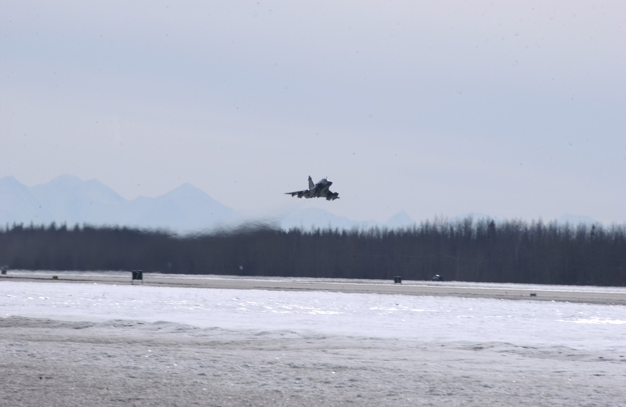 EIELSON AIR FORCE BASE, Alaska -- The French Air Force Mirage 2000 takes off on April 6 for Red Flag-Alaska 07-1. Red Flag-Alaska is a Pacific Air Forces-directed field training exercise for U.S. forces flown under simulated air combat conditions.  It is conducted on the Pacific Alaskan Range Complex with air operations flown out of Eielson and Elmendorf Air Force Bases. (U.S. Air Force Photo by Airman 1st Class Jonathan Snyder) (Released)