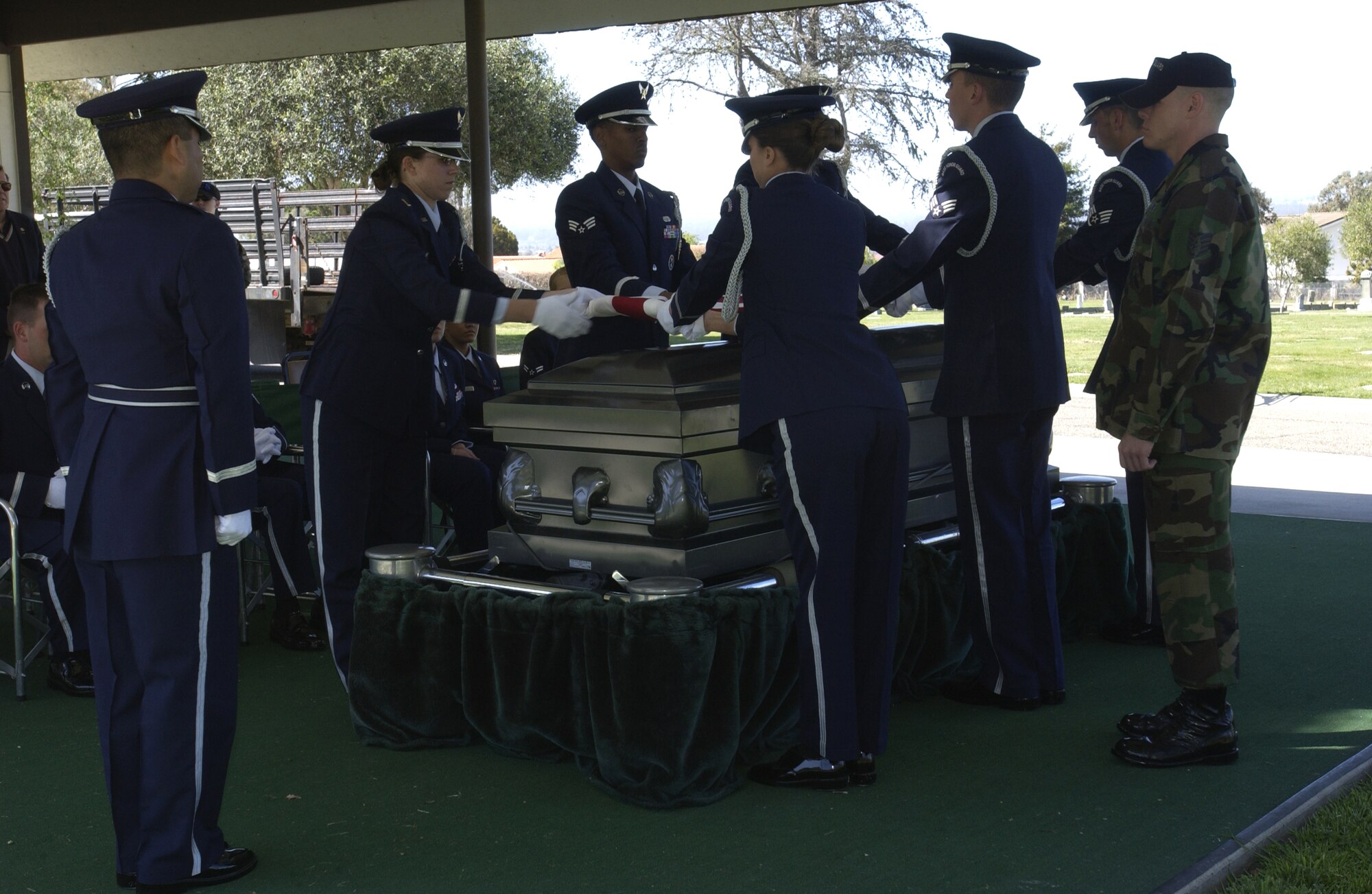 Vandenberg Honor Guardsmen perform the flag folding ceremony at the Lompoc Cemetery April 3 as the final scenario of eight-days of training.  The Air Force Honor Guard’s Mobile Training Team from Bolling Air Force Base, Washington, D.C., teaches 15 courses a year with its primary focus on global standardization of military funerals. (Photo by Staff Sgt. Christina Rumsey)