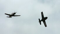 The last Randolph T-37B Tweet peels off to the west while a T-6Texan II flies ahead symbolizing the past and future of the primary pilot instructor training mission. (U.S. Air Force photo by Dave Terry) 