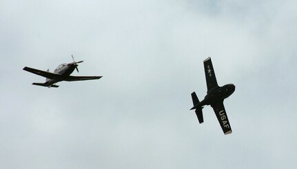 The last Randolph T-37B Tweet peels off to the west while a T-6Texan II flies ahead symbolizing the past and future of the primary pilot instructor training mission. (U.S. Air Force photo by Dave Terry) 