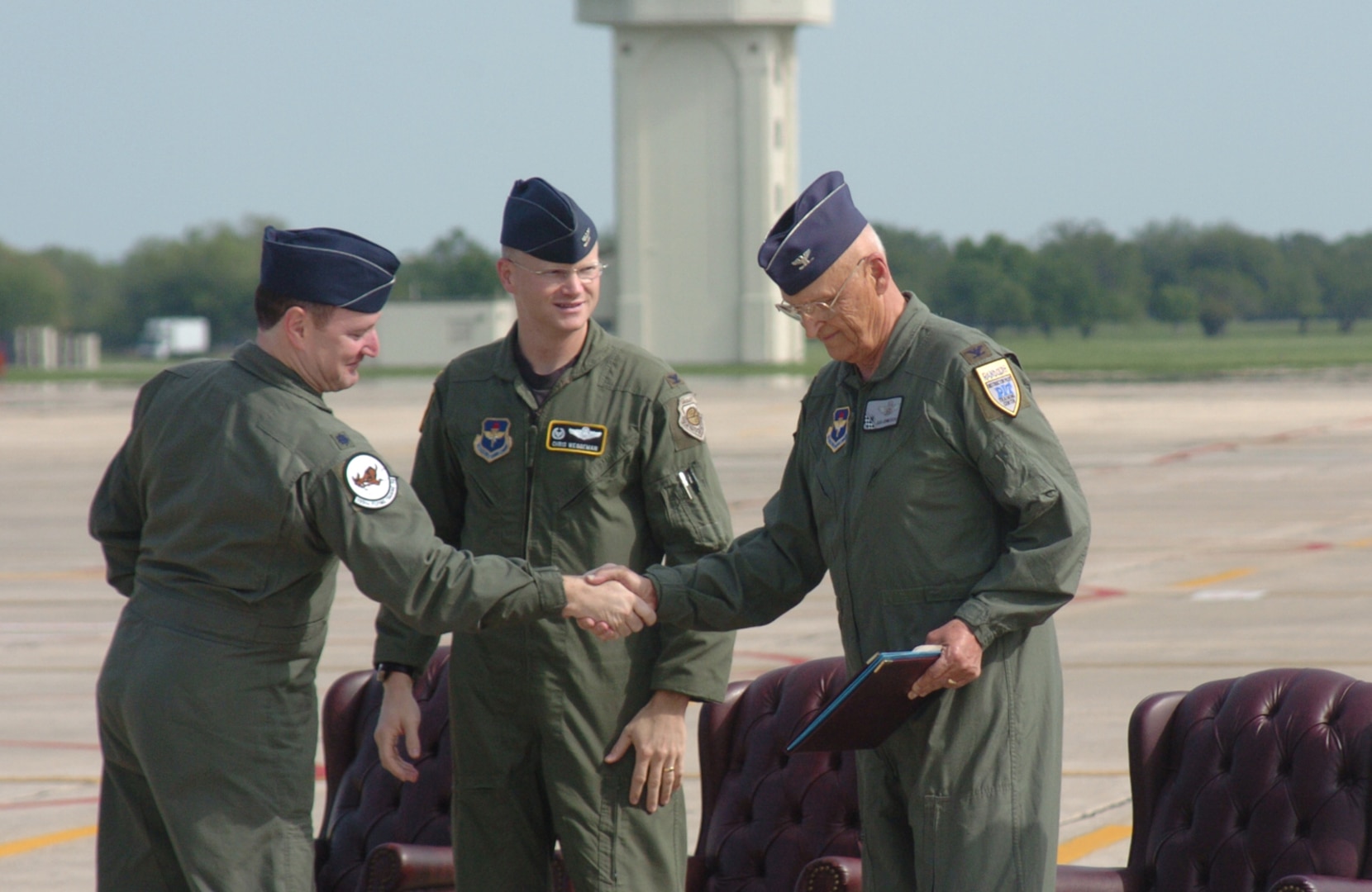 Lt. Col. Jimmy Donohue, (left) 559th Flying Training Squadron commander, and Col. Christopher Weggeman, 12th Operations Group commander, thank retired Col. Robert Hermanson, 559th FTS commander from July 1974 to July 1976, for his service with the unit and the Tweet. Colonel Hermanson was the guest speaker at the T-37B base retirement ceremony April 6. (U.S. Air Force photo by Dave Terry)