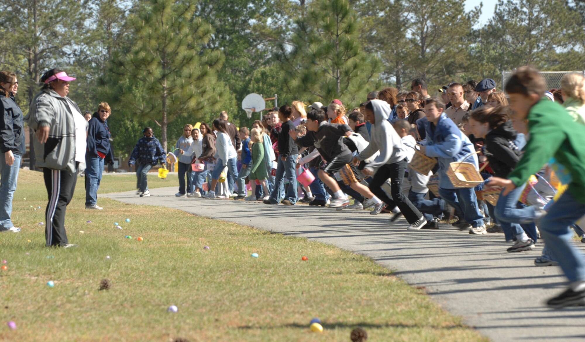 Team Moody children race to find their fair share of eggs during Moody's Easter Egg Hunt April 7. The event, is an held annually for children between the ages of 3 months to 12 years. (U.S. Air Force photo by Staff Sgt. Joshua Jasper)