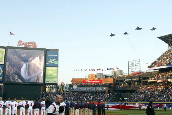Air Force jets perform a flyby in celebration of the Atlanta Braves baseball opening day at Turner Field on April 6, 2007.  Two F-15 and two F-22 fighter aircraft represent the Heritage to Horizons theme for the Air Force during the performance of the Star-Spangled Banner.  The tribute to the Air Force's 60th Anniversary is represented by baseballs that will make a trip around the world and return to Turner Field in September.  The Heritage to Horizons events throughout the year all lead up to Atlanta Air Force Week, hosted by Air Force Reserve Command, Oct. 8-14, 2007. (U.S. Air Force photo/Don Peek)