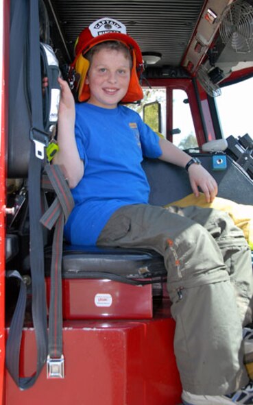Technical Sgt. Matt Simpson’s son checks out a fire truck during the Spring Fling event held at March Air Reserve Base. (U.S. Air Force photo by Senior Airman Diane Ducat, 163 RW/PA)