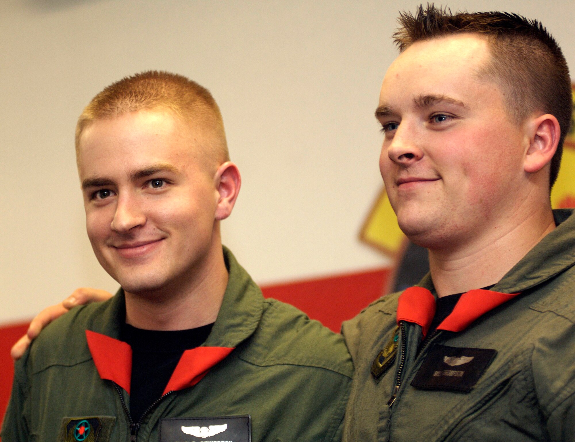 Airman 1st Class Evan Pinkerton, left, and 1st Lt. Will Thompson stand together after a ?scarfing ceremony? at the 551st Special Operations Squadron, here. Airman Pinkerton is the last flight engineer student to graduate from the squadron, and Lieutenant Thompson is the final pilot to graduate. (U.S. Air Force photo by Lt. Col. Alex Carothers)