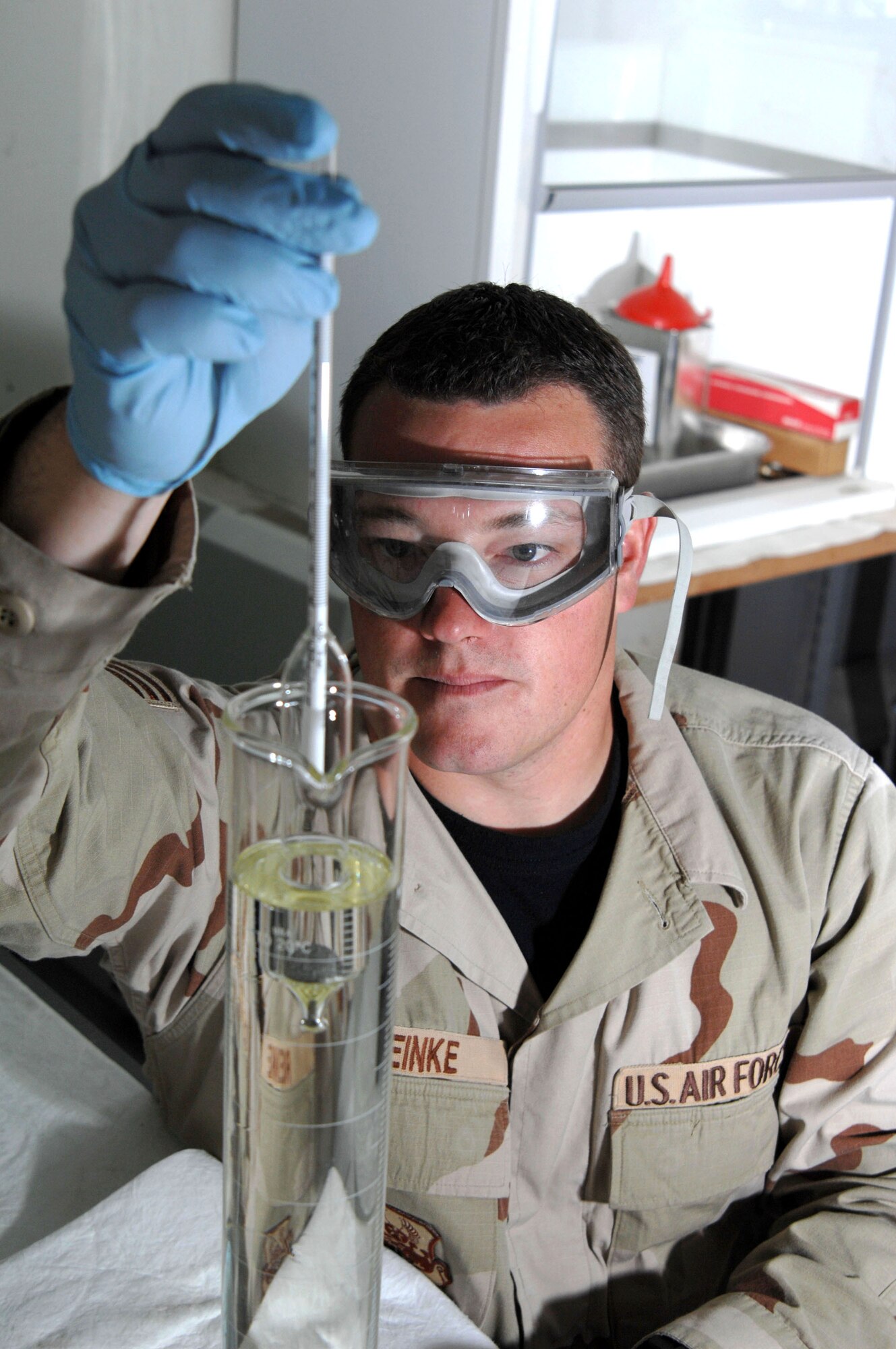 Senior Airman Jason Reinke performs a specific gravity test on JP-8 fuel April 5 at Kirkuk Air Base in Iraq. The fuels lab provides quality control to all fuel used by local Air Force, Army, and Iraqi personnel. Airman Reinke is a fuels lab technician with the 506th Expeditionary Logistics Readiness Squadron. (U.S. Air Force photo/Senior Airman Bradley A. Lail)
