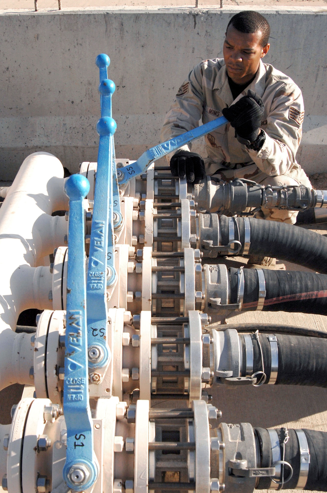 Staff Sgt. Edward Mims opens the recirculation valve to a skid fuel receiver April 5 at Kirkuk Air Base in Iraq. Sergeant Mims is a fuels supervisor with the 506th Expeditionary Logistics Readiness Squadron. (U.S. Air Force photo/Senior Airman Bradley A. Lail)

