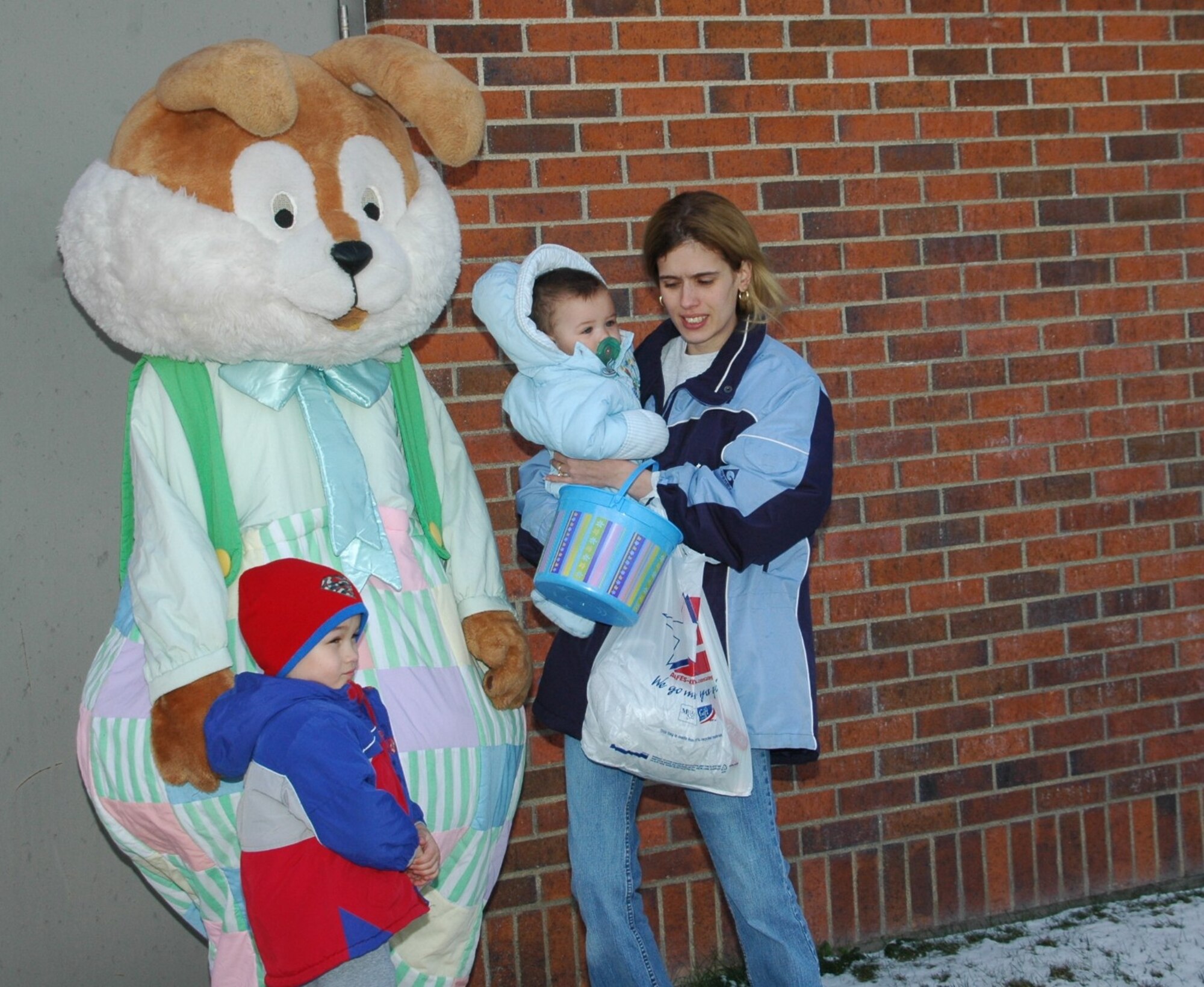 Children visited with the Easter bunny after hunting eggs. A free base-wide Easter egg hunt was held April 7 outside the base exchange. Approximately 600 children met the Easter Bunny, hunted for eggs and got free face paintings. The children were divided into two age groups to hunt for the 3,000 eggs which all contained candy or prize coupons.