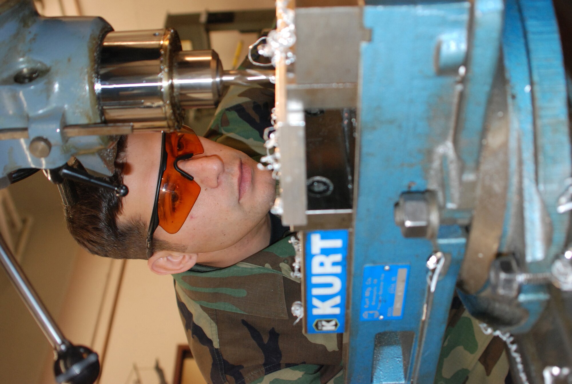 Air Force Reserve Tech. Sgt. Calogero Vella in the Metals Technology Shop intricately manufactures an aircraft main landing gear bushing from a block of aluminum. By constructing this part in-house it saves the 301st Fighter Wing a couple hundred dollars per part manufacuted, a cost savings in the thousands for the Air Force Reserve. (U.S. Air Force Photo/Tech. Sgt. Stephen Bailey)