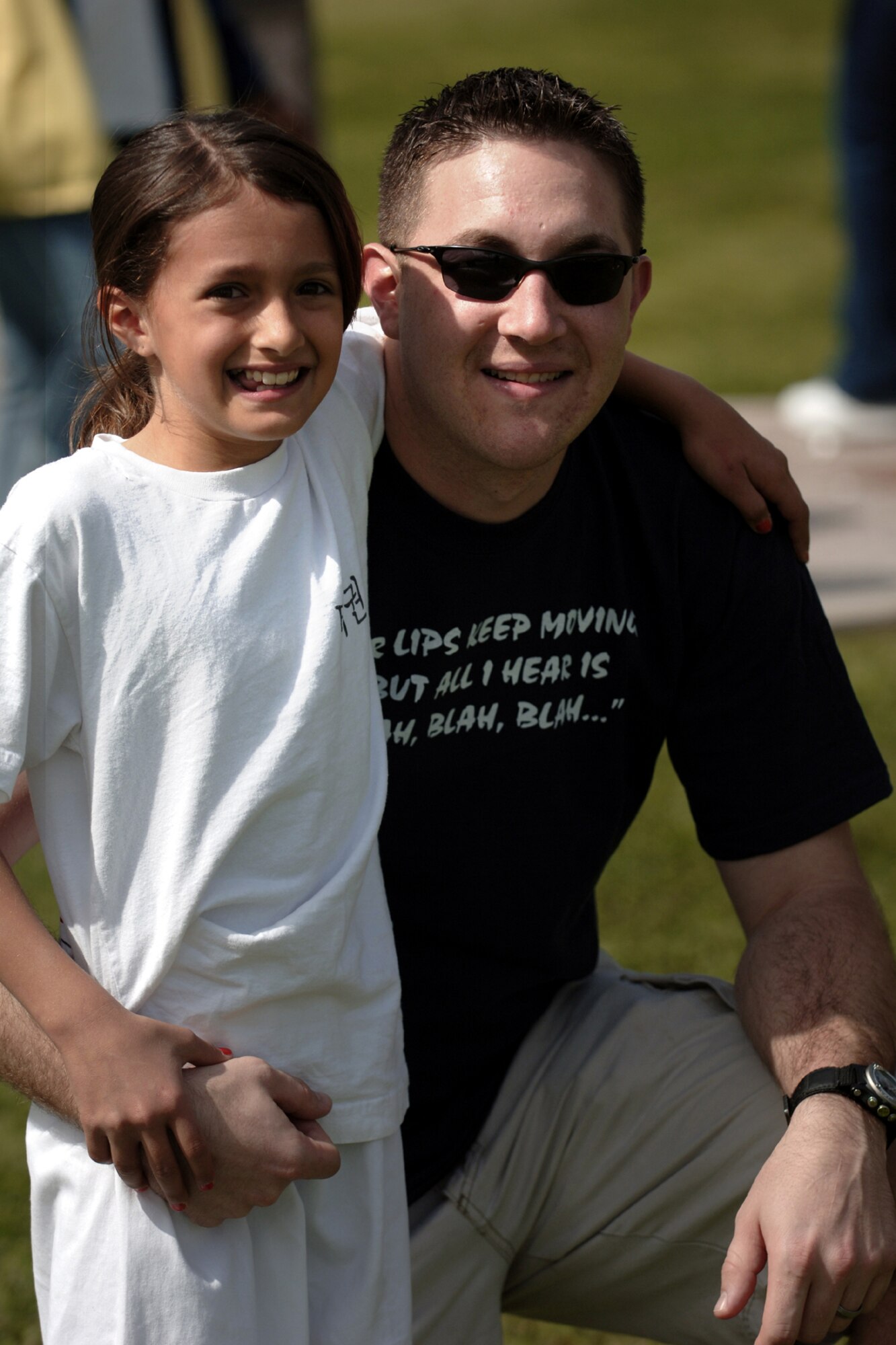 Cheyanne Braun and her step father Staff Sgt. Robert Groves pose for a photo after winning the egg toss during the Easter Festivities April 7.  The event which was put together by members of the youth center included an egg hunt, games, music, face painting, and crafts for the kids.  The Easter Bunny also made an appearance to hand out Easter eggs, and to take photos with children and adults.  (U. S. Air Force photo by Airman 1st Class Nathan W. Lipscomb)