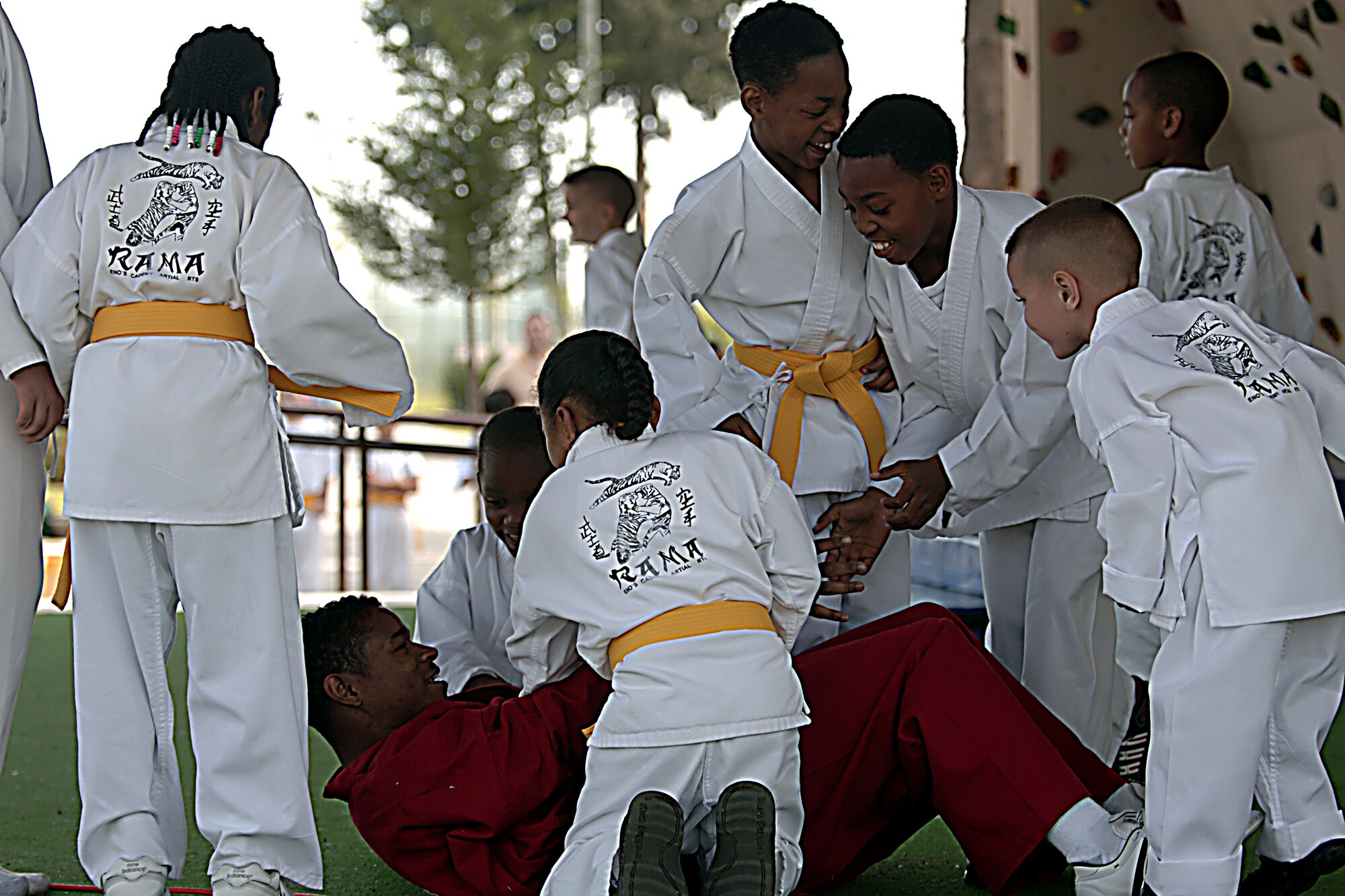 Staff Sgt. Bruce Reno of the 39th Medical Group let his students take him daown at the end of their demonstration during the Easter Festivities, April 7.  The event which was put together by members of the youth center included an egg hunt, games, music, face painting, and crafts for the kids.  The Easter Bunny also made an appearance to hand out Easter eggs, and to take photos with children and adults.  (U. S. Air Force photo by Airman 1st Class Nathan W. Lipscomb)