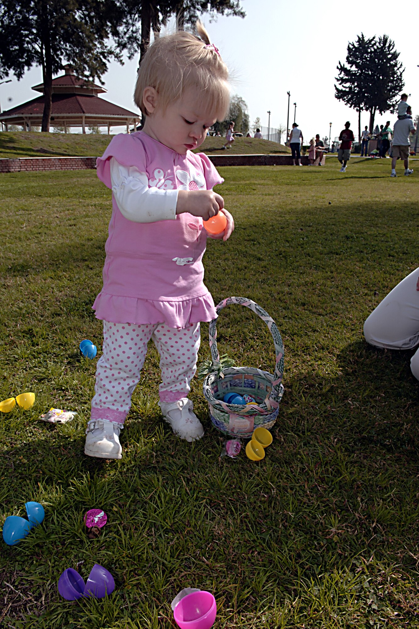 Morgan Phibbs opens her eggs after the Easter Egg Hunt, April 7.  The Easter Celebration was put together by members of the youth center which included an egg hunt, games, music, face painting, and crafts for the kids.  The Easter Bunny also made an appearance to hand out Easter eggs, and to take photos with children and adults.  (U. S. Air Force photo by Airman 1st Class Nathan W. Lipscomb)
