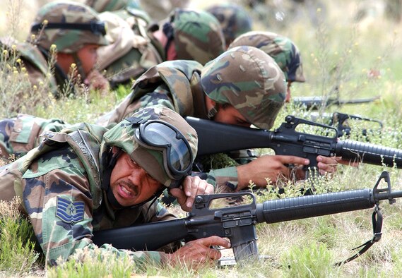 Airmen from one of the Nuclear Weapons Center?s units prepare for combat during an exercise here. The NWC is not only consolidating the Air Force?s nuclear weapons functions under the leadership of one unit, it is also training its Airmen to fight terrorism and preparing them for their duties in combat. The center is celebrating a year of success and superior performances in headquarters lead inspections. (U.S. Air Force photo by Todd Berenger)                               