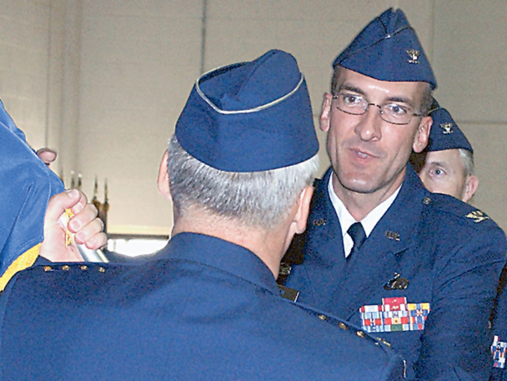Col. Terrence A. Feehan receives command of the Nuclear Weapons Center here from Gen. Bruce Carlson, Air Force Materiel Command commander, July 7. The center stood up March 31, 2006. (U.S. Air Force photo by Dennis Carlson)                               