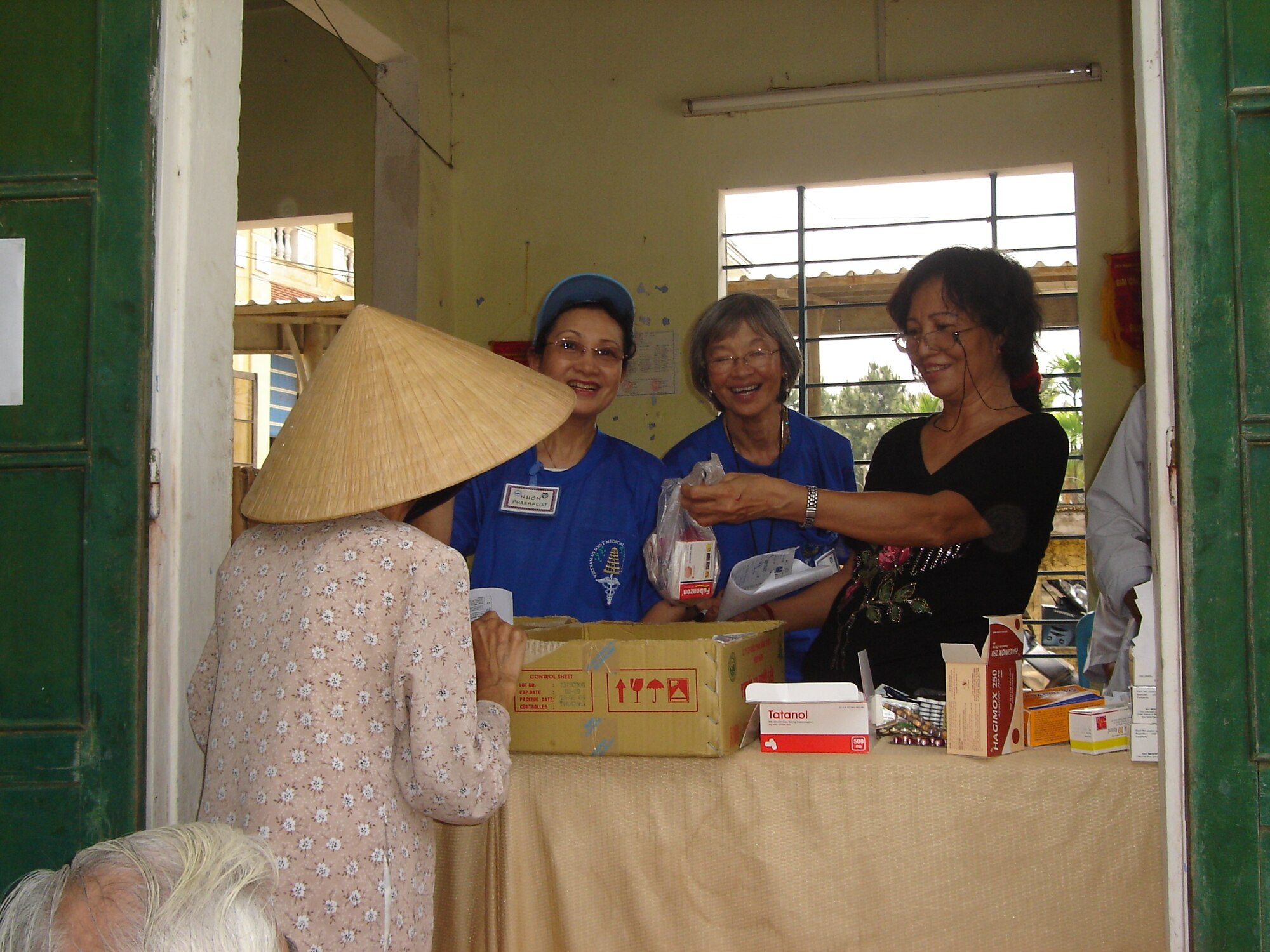 VIETNAM -- The pharmacy staff at Thuy Bieu village.  From L to R:  Mrs. Nhon Tran, Aloha Medical Mission, Mrs. Thanh Lo Sananikone, AMM, and Ms.  Pham Thi Tao, volunteer pharmacist from Thuong Lac Dispensary. This humanitarian assistance effort was funded by US Pacific Command as a high priority Asia-Pacific Regional Initiative. It was planned and executed as a first-ever joint venture by US Army Pacific (USARPAC), Pacific Air Forces, 624 Regional Support Group, and two Non-Governmental Agencies: The East Meets West Foundation (EMWF) based in Vietnam and the AMM based in Hawaii.  (photo by Capt Fritz Craft)