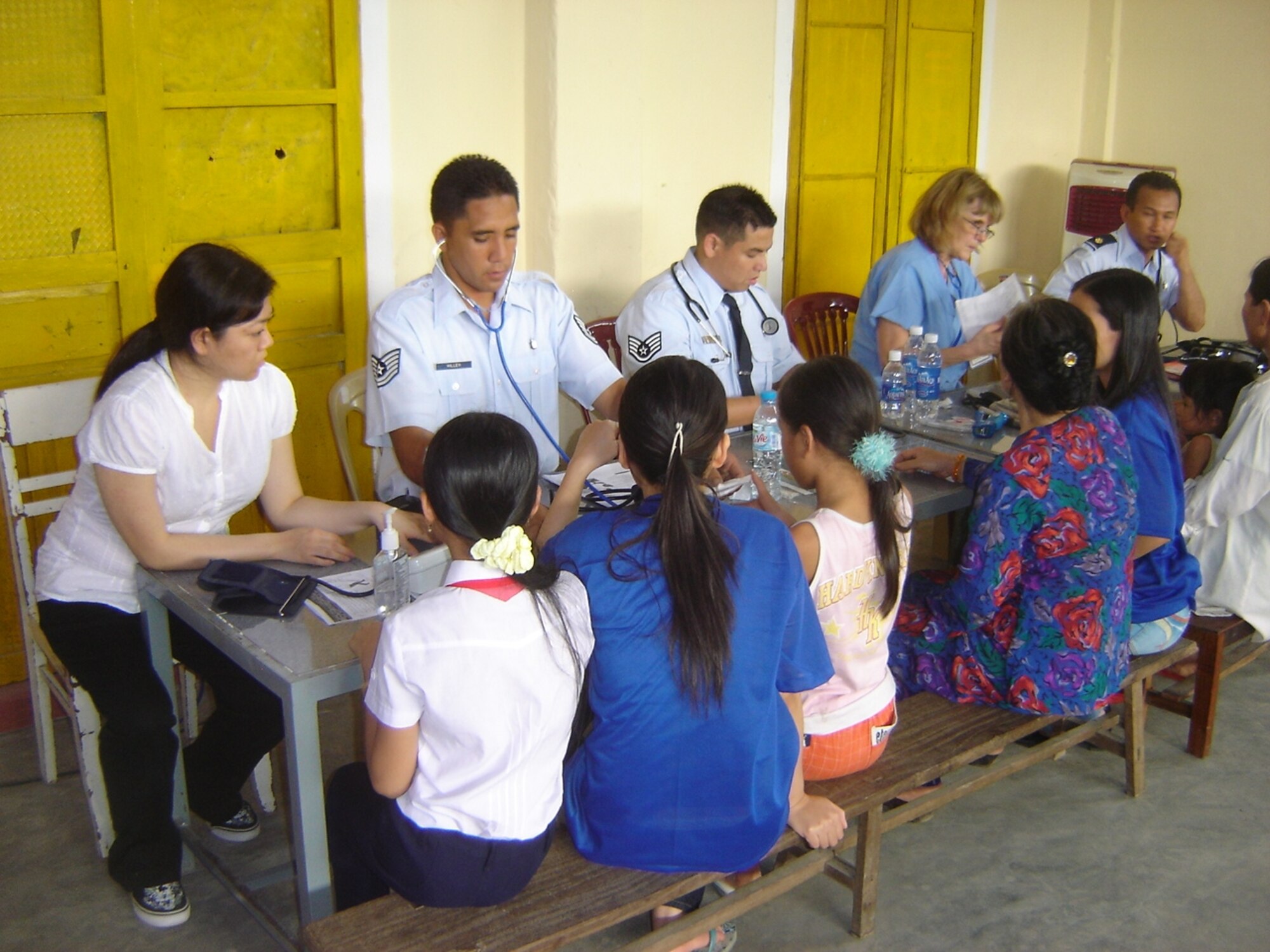 VIETNAM -- The Pacific Air Forces screening team performs a screening of vital signs:  From left to right:  Ms. Kylie Abe, Aloha Medica Mission volunteer; TSgt Carl Hillen, 624 Regional Support Group; SSgt Leonard Fontanilla, 624 RSG; Ms. Bonne Beneke, AMM, and Maj. Edilbert Castro, 624 RSG.  This humanitarian assistance effort was funded by US Pacific Command as a high priority Asia-Pacific Regional Initiative. It was planned and executed as a first-ever joint venture by US Army Pacific (USARPAC), Pacific Air Forces, 624 Regional Support Group, and two Non-Governmental Agencies: The East Meets West Foundation (EMWF) based in Vietnam and the AMM based in Hawaii.  (photo by Capt Fritz Craft)