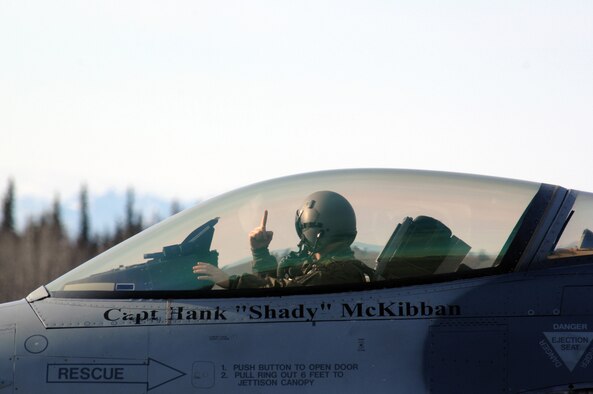 EIELSON AIR FORCE BASE, Alaska -- A pilot from the 61st Fighter Squadron "Top Dogs", Luke Air Force Base, Arizona signals to his crewchief while taxiing to take off on a mission during Red Flag-Alaska 07-1 here on April 10. Red Flag-Alaska is a Pacific Air Forces-directed field training exercise for U.S. forces flown under simulated air combat conditions. It is conducted on the Pacific Alaskan Range Complex with air operations flown out of Eielson and Elmendorf Air Force Bases. 
(U.S. Air Force Photo by Staff Sgt Joshua Strang) 