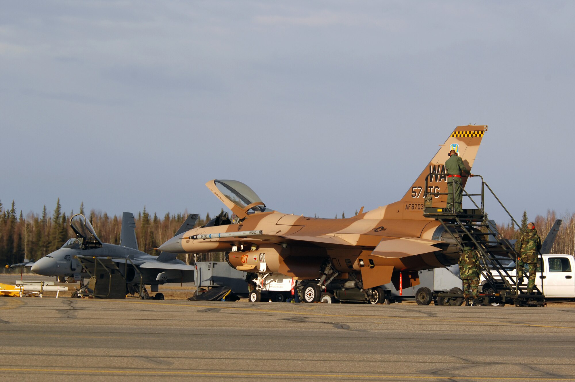 EIELSON AIR FORCE BASE, Alaska -- Maintainers from the 64th Aggressor Squadron, Nellis Air Force Base, Nevada, prep an F-16 prior to a mission during Red Flag-Alaska 07-1 here on April 10. Red Flag-Alaska is a Pacific Air Forces-directed field training exercise for U.S. forces flown under simulated air combat conditions. It is conducted on the Pacific Alaskan Range Complex with air operations flown out of Eielson and Elmendorf Air Force Bases. 
(U.S. Air Force Photo by Staff Sgt Joshua Strang) 