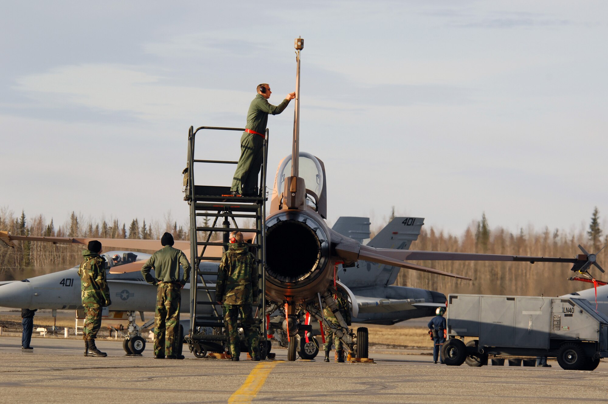 EIELSON AIR FORCE BASE, Alaska -- Maintainers from the 64th Aggressor Squadron, Nellis Air Force Base, Nevada, prep an F-16 prior to a mission during Red Flag-Alaska 07-1 here on April 10. Red Flag-Alaska is a Pacific Air Forces-directed field training exercise for U.S. forces flown under simulated air combat conditions. It is conducted on the Pacific Alaskan Range Complex with air operations flown out of Eielson and Elmendorf Air Force Bases. 
(U.S. Air Force Photo by Staff Sgt Joshua Strang) 