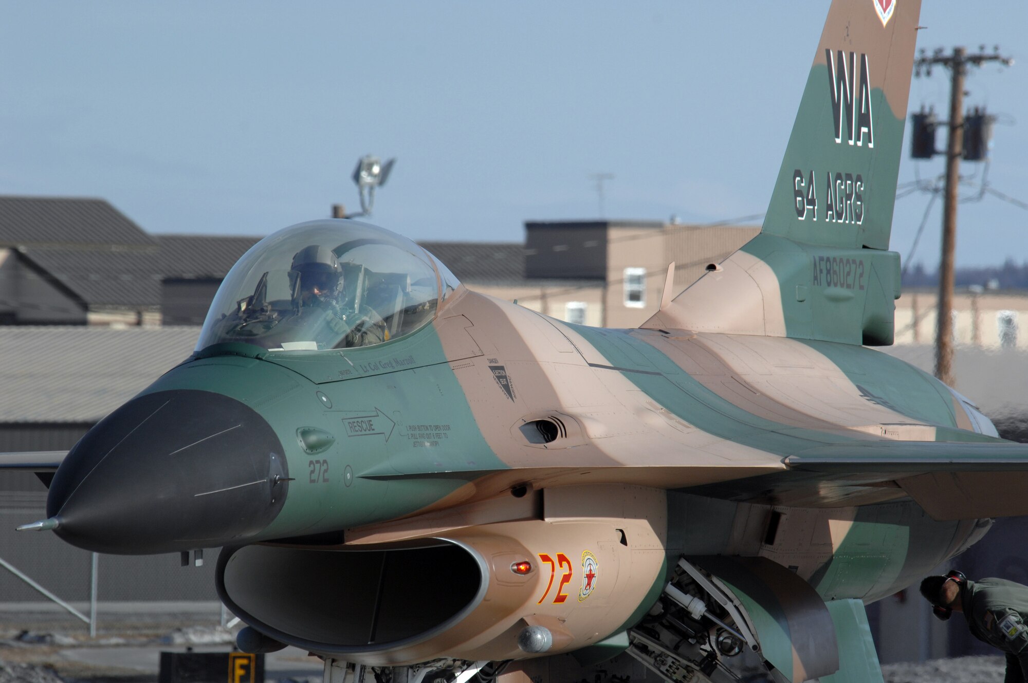 EIELSON AIR FORCE BASE, Alaska -- An F-16 Fighting Falcon from the 64th Aggressor Squadron, Nellis Air Force Base, Nevada taxis to take off for a mission during Red Flag-Alaska 07-1 here on April 10. Red Flag-Alaska is a Pacific Air Forces-directed field training exercise for U.S. forces flown under simulated air combat conditions. It is conducted on the Pacific Alaskan Range Complex with air operations flown out of Eielson and Elmendorf Air Force Bases. 
(U.S. Air Force Photo by Staff Sgt Joshua Strang) 