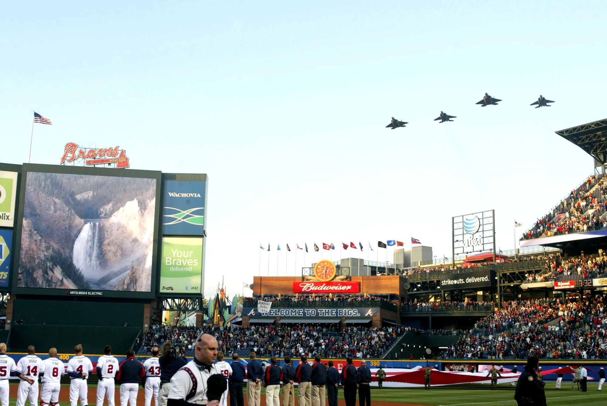 Air Force jets perform a flyby in celebration of the Atlanta Braves baseball opening day at Turner Field April 6 in Atlanta. Two F-15 Eagles and two F-22 Raptors represent the Heritage to Horizons theme for the Air Force during the performance of the national anthem. The tribute to the Air Force's 60th Anniversary is represented by baseballs that will make a trip around the world and return to Turner Field in September. The Heritage to Horizons events throughout the year all lead up to Atlanta Air Force Week, hosted by Air Force Reserve Command Oct. 8-14. (U.S. Air Force photo/Don Peek)
