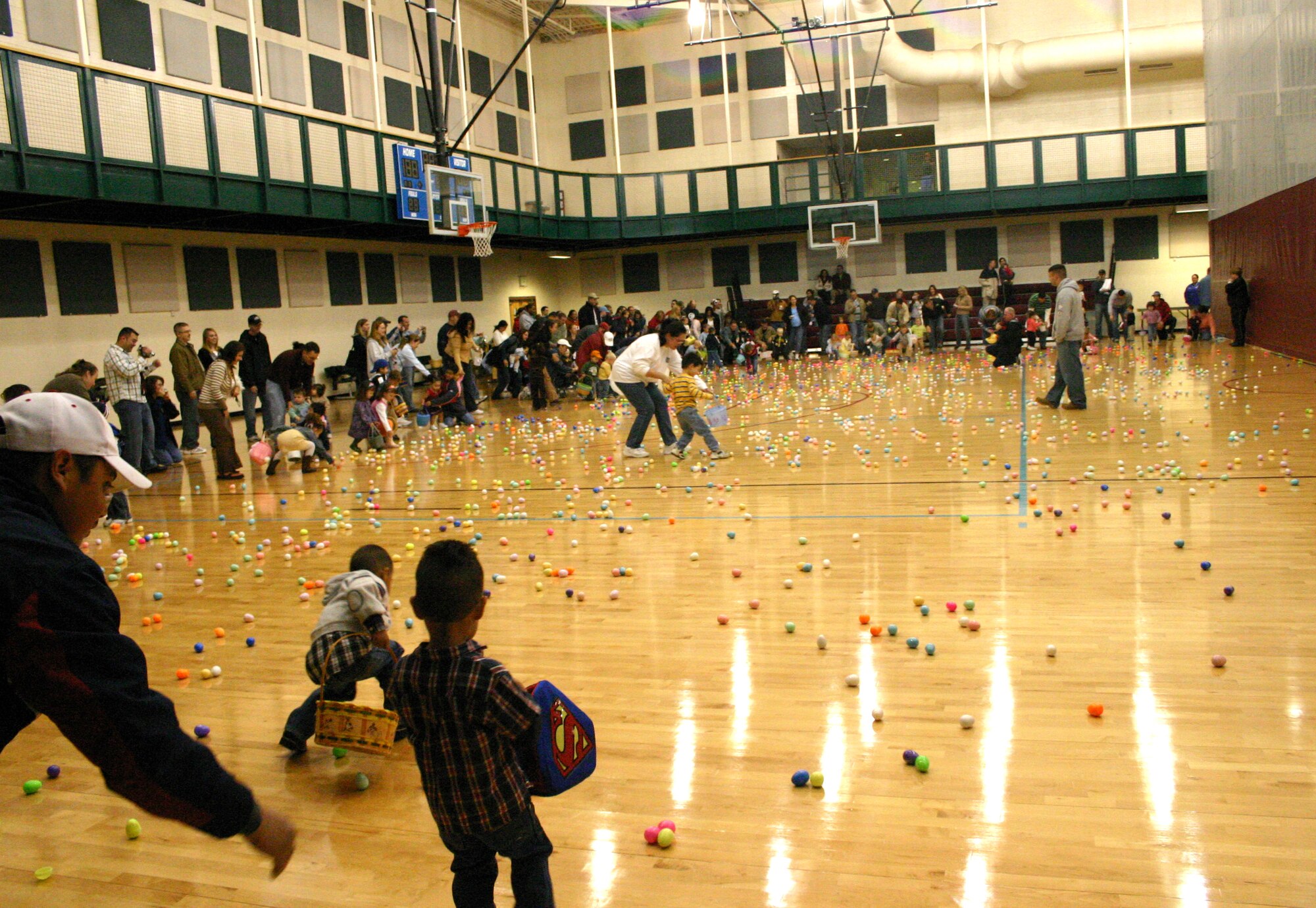 LAUGHLIN AIR FORCE BASE, Texas -- Even a little rain couldn?t stop the base children from celebrating Easter the best way they knew how by collecting candy-filled Easter eggs from the Losano Fitness Center's gym Saturday morning. (U.S. Air Force photo by Airman Sara Csurilla)