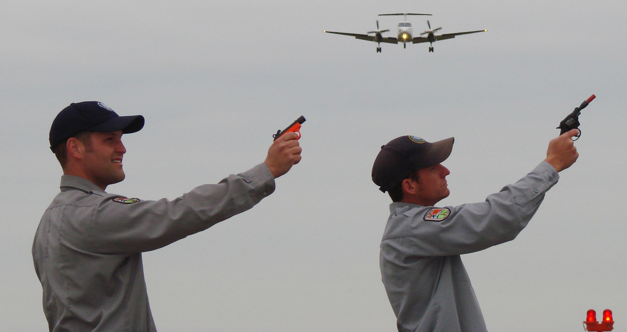VANCE AIR FORCE BASE, Okla. -- Jesse Townsend and Matt Smith, USDA Wildlife Services biological science technicians, prepare to fire pyrotechnics.  (U.S. Air Force photo/2nd Lt. James Justice)