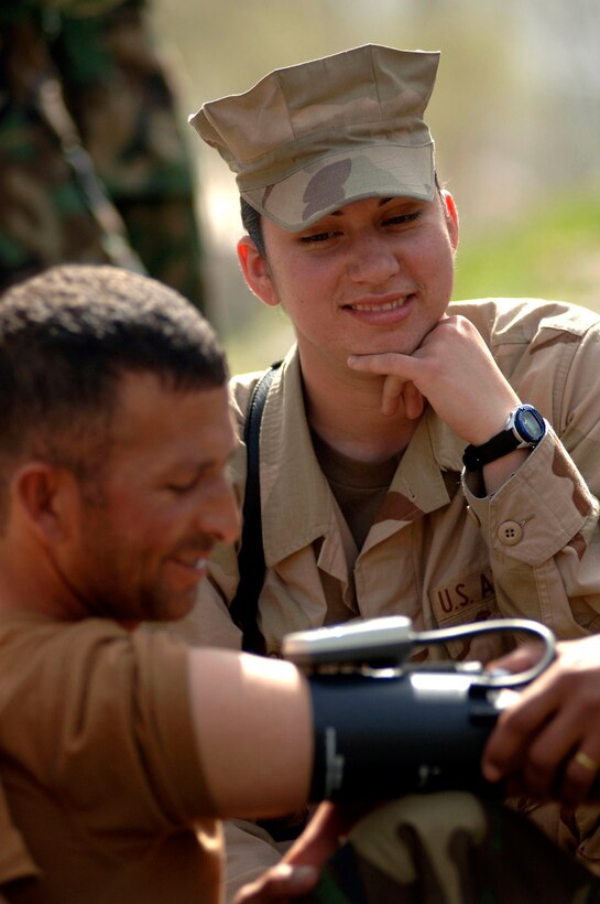 Senior Airman Lucinda Church supervises a hands-on training for taking vital signs in the field with Afghan National Army soldiers participating in the Combat Medic Course in Kabul, Afghanistan. Airman Church is a mentor assigned to the Combat Medic School. (U.S. Air Force photo/Tech. Sgt. Cecilio M. Ricardo Jr.)