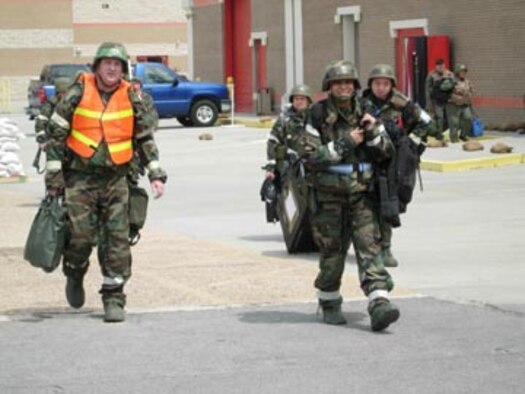 GULFPORT COMBAT READINESS TRAINING CENTER, Miss. -- Members of the 459th Air Refueling Wing return to the their duty stations after a simulated mortar attack and evacuation. (U.S. Air Force photo/Staff Sgt. Amaani Lyle)