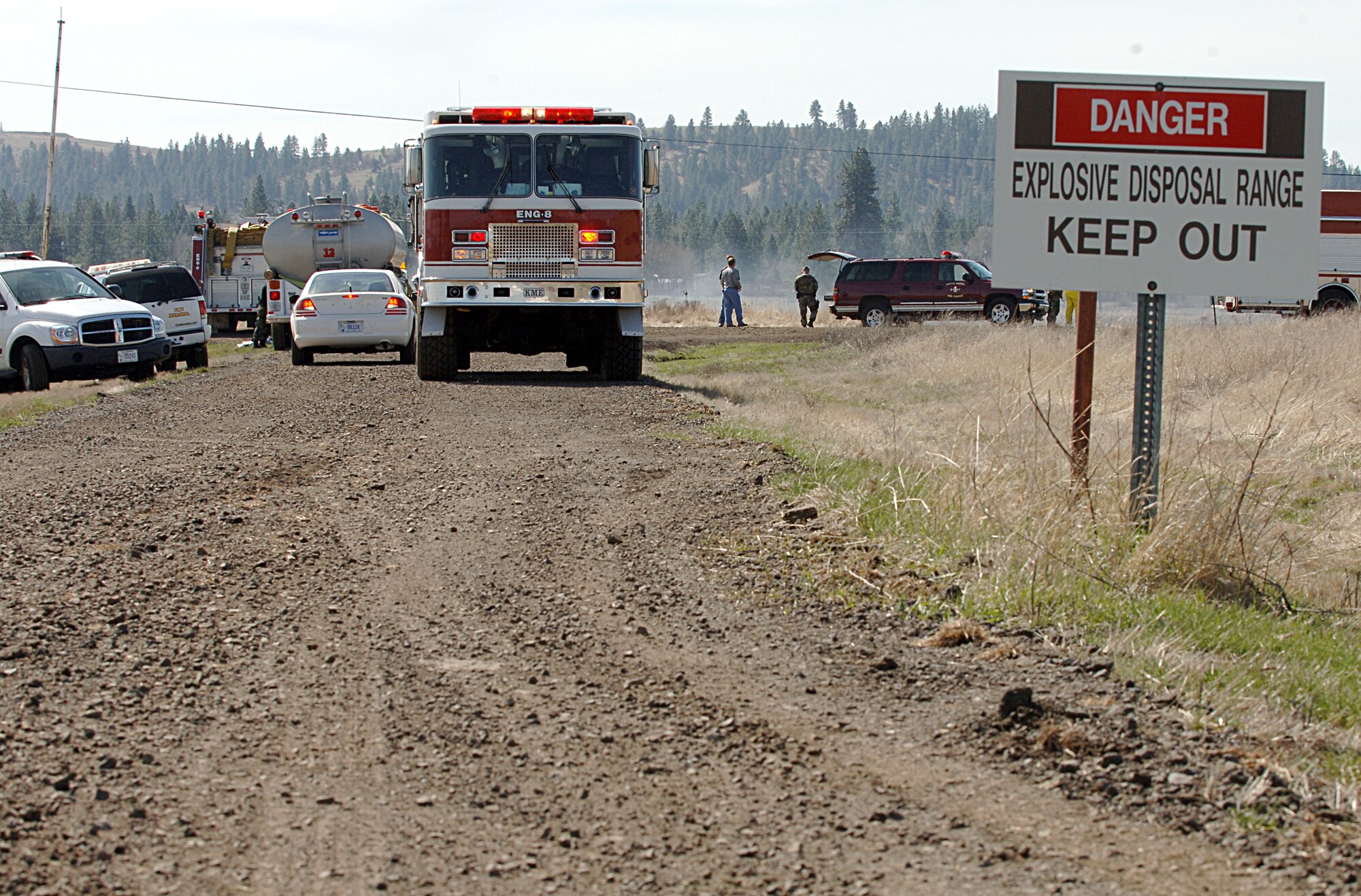 FAIRCHILD AIR FORCE BASE, Wash. -- The Fairchild Fire Department responds to a brush fire that started on the explosive ordinance disposal range here April 6. The fire started around 10:45 a.m. during Survival School training activities and was contained by the firefighters at about noon. (U.S. Air Force photo/Airman 1st Class Joshua Chapman)