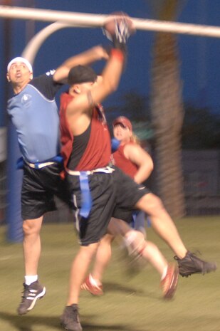 Chris Cates catches a 2 point conversion after Nellis scored a touchdown during their game against National Security Tech (NST). Nellis went on to beat NST 26-0 and took 2nd place in the event. (U.S. Air Force Photo/Senior Airman Jason Huddleston)