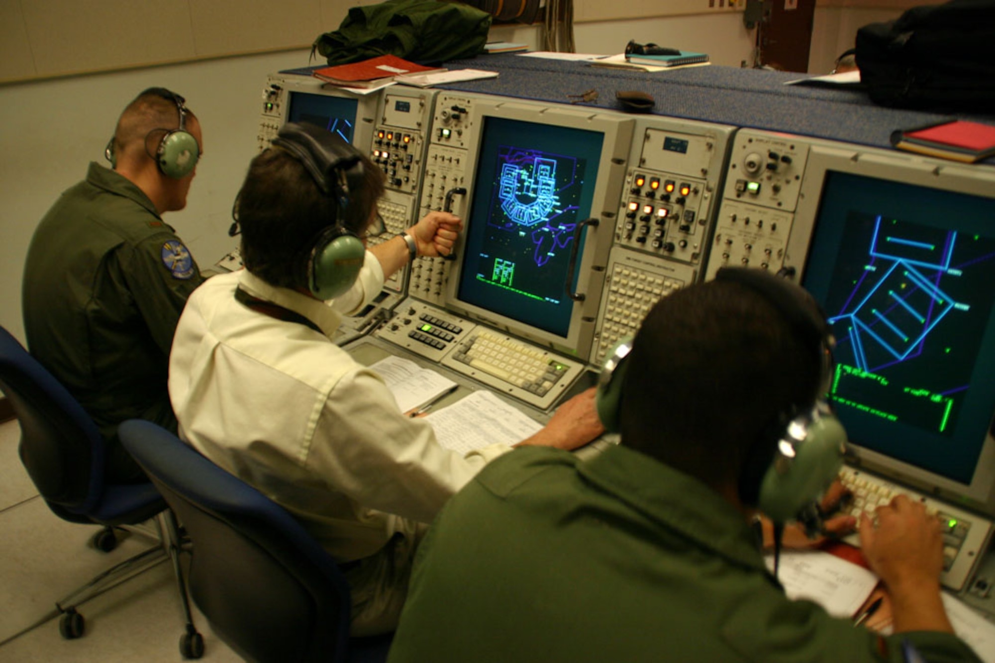 (TINKER AIR FORCE BASE, Okla.) Airmen and civilians from the 552nd Air Control Wing work in the mission simulators during a training exercise.  The programs used in the mission sims, as well as in the E-3 Sentry itself during real-world missions, are written, tested and released for use by Airmen in the 552nd Communications Group. (Air Force photo by Staff Sgt. Stacy Fowler)