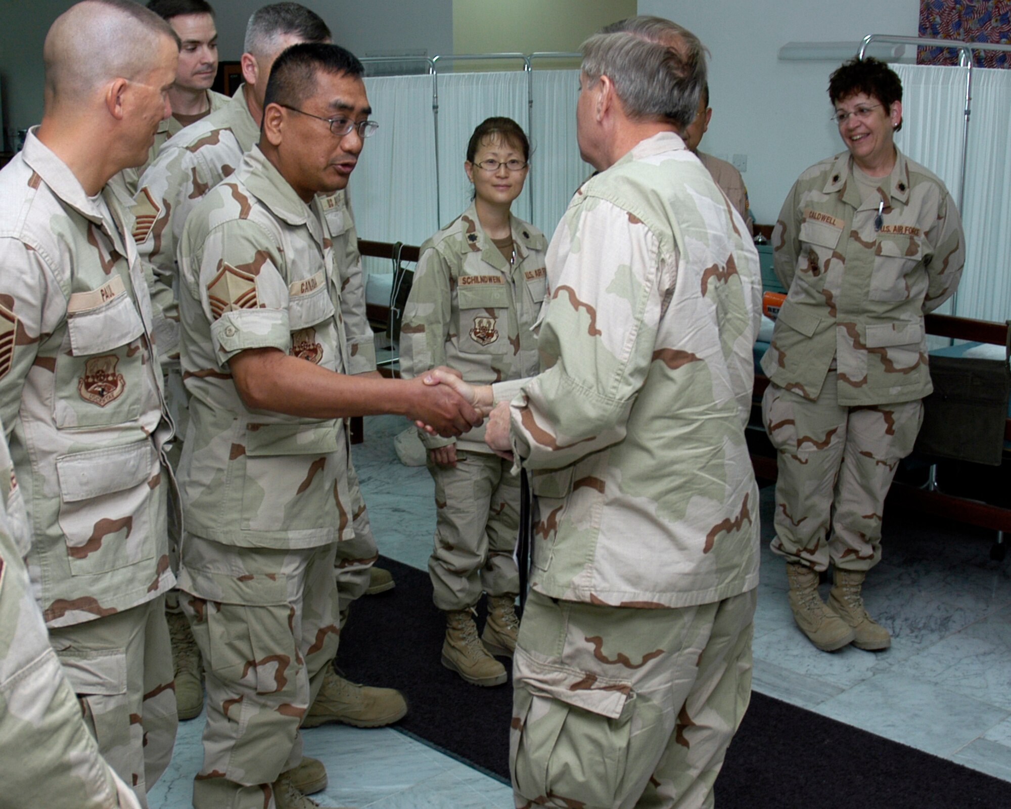 SOUTHWEST ASIA -- Col. Lindsey Graham, a Senior Senator from North Carolina, greats Master Sgt. Eric Canada, 386th Expeditionary Medical Group, in the Contingency Air Medical Staging Facility here on the Rock on April 9, 2007. Col. Graham, a Reserve Judge Advocate, recently spent 2 days in Iraq with Senator John McCain, then another 7 days as a JA with the Multinational Force, Iraq. (AF photo/Staff Sgt. Ian Carrier)                                  