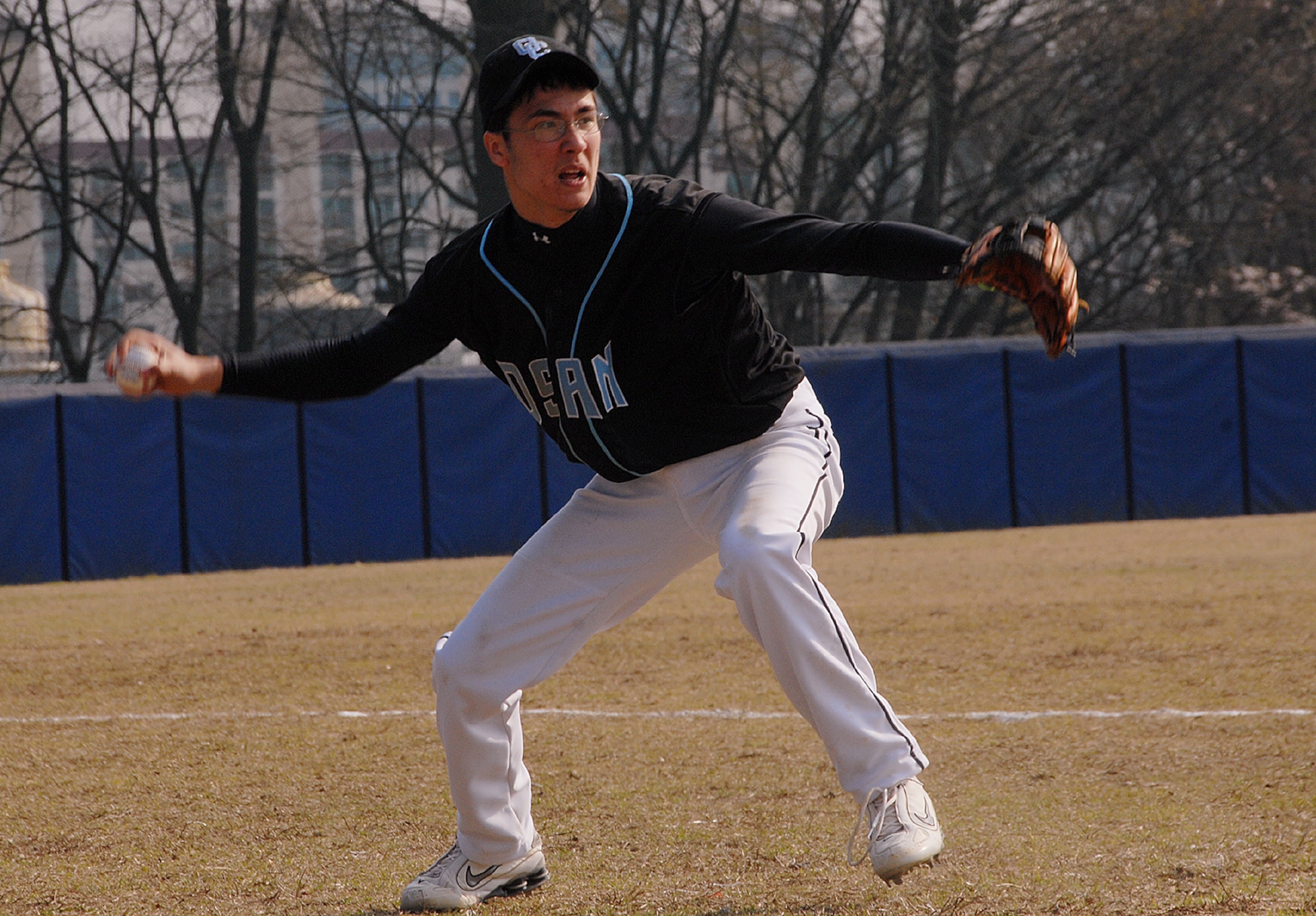 CHEONAN, Republic of Korea --  John Apelin tries to beat a runner to the plate as the Osan American High School Cougars and Cheonan Bukil High School baseball teams faced each other for the first time April 6. (U.S. Air Force photo by Airman 1s Class Chad Strohmeyer)