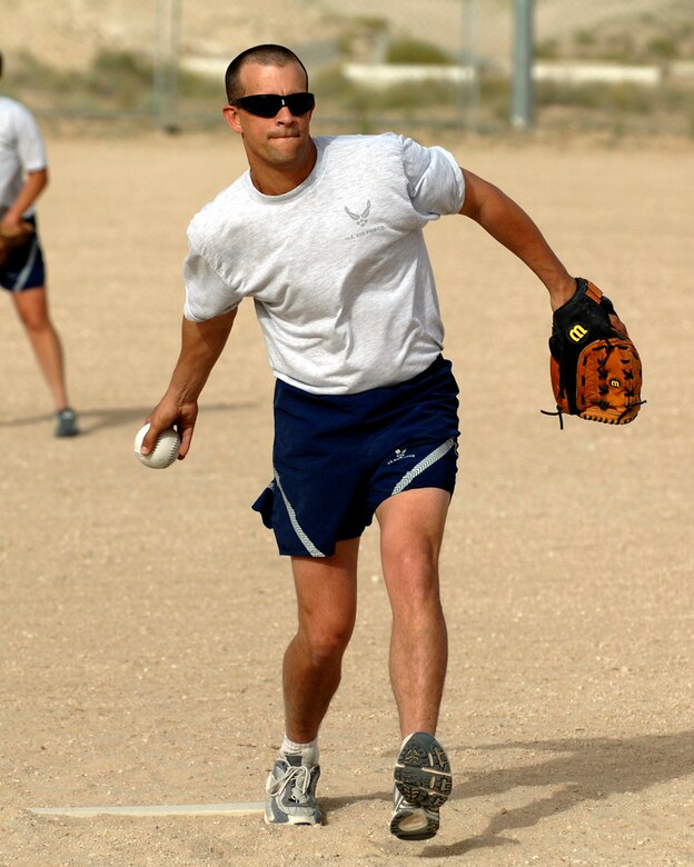 SOUTHWEST ASIA -- Master Sgt. Jeffrey Statz, 386th Expeditionary Contracting Squadron, prepares to hurl a pitch during the 386th Air Expeditionary Wing softball championship April 8, 2007. The Wing Staff team defeated Security Forces 13-10. Sgt. Statz was recognized as one of the key players of the game by the coach. (AF photo/Tech. Sgt. Edward Holzapfel)