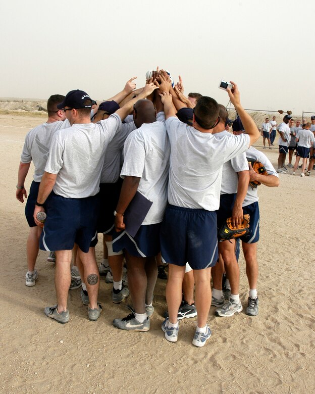 SOUTHWEST ASIA -- The Wing Staff softball team celebrates victory after defeating the Security Forces team in the 386th Air Expeditionary Wing softball championship April 8, 2007. The Wing team went 7-1 during the regular season. The final score of the championship game was 13-10. (AF photo/ Staff Sgt. Ian Carrier)                               