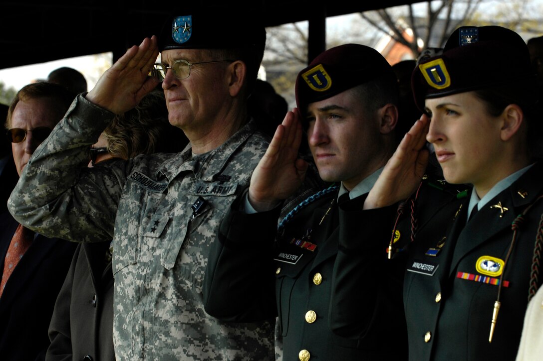 U.S. Army Maj. Gen. Eric Schoomaker, left, commander of Walter Reed Army Medical Center and brother of outgoing Army Chief of Staff Gen. Peter J. Schoomaker, salutes during the national anthem as part of the U.S. Army Chief of Staff change of responsibility ceremony at Fort Myer, Va., April 10, 2007.