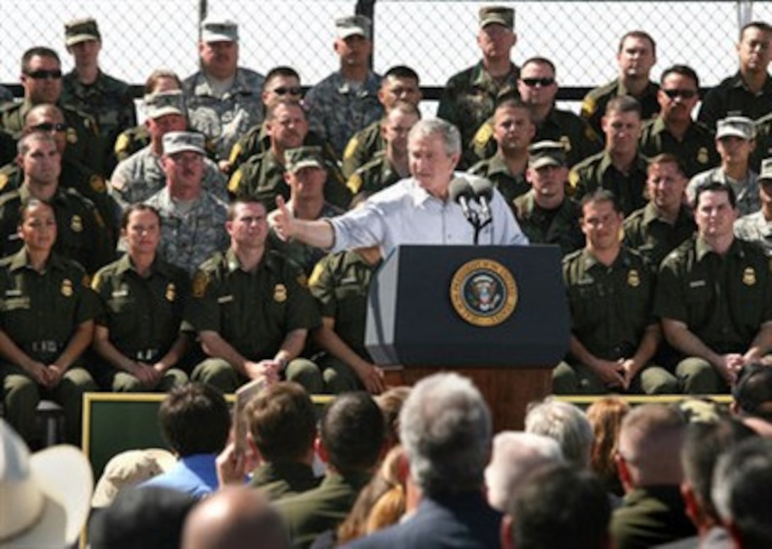 President George W. Bush thanks members of the National Guard for helping the Border Patrol crack down on illegal entry into America, during a speech in Yuma, Ariz., April 9, 2007.