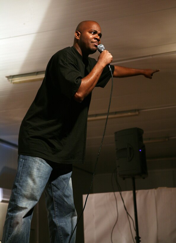 AL ASAD, Iraq --  Jamal Doman points out into the crowd during his comedic performance at the Al Asad Morale, Welfare and Recreation Center, April 10. Doman, along with Tobe Hixx and Chris Simpson, held a two-hour standup comedy show for service members.